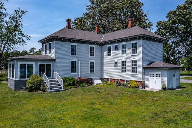 118 Harvey Ln, Heathsville, VA 22473 - rear view of house featuring a lawn and a chimney