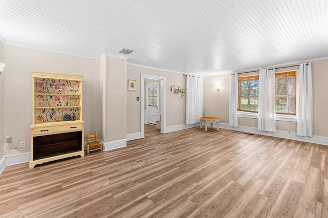 1838 Muddy Gut Rd, Dunnsville, VA 22454 - unfurnished living room featuring light wood-type flooring, ornamental molding, and baseboards