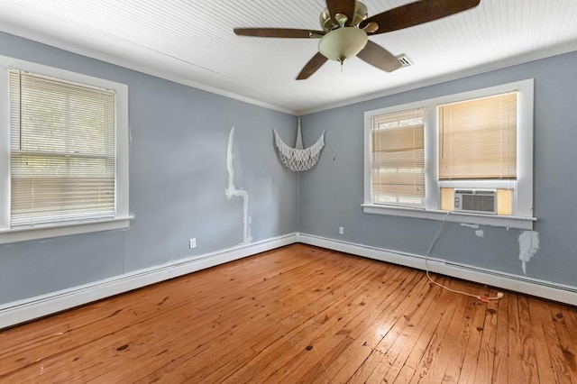 1838 Muddy Gut Rd, Dunnsville, VA 22454 - spare room featuring cooling unit, hardwood / wood-style flooring, a baseboard radiator, a ceiling fan, and crown molding