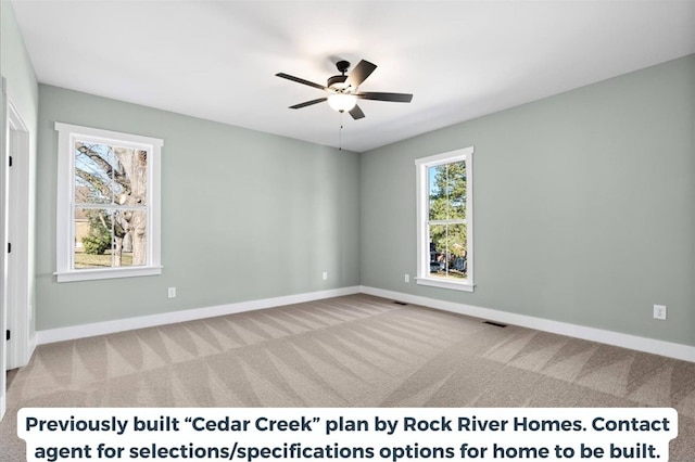 carpeted empty room featuring ceiling fan