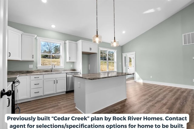 kitchen featuring white cabinetry, appliances with stainless steel finishes, and a center island