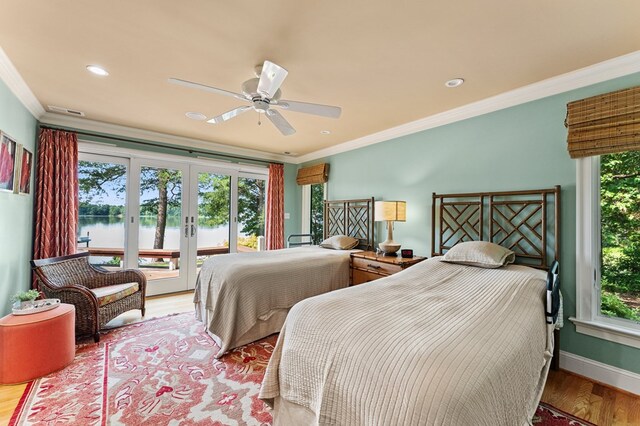 873 Deep Creek Rd, Lancaster, VA 22503 - bedroom with crown molding, a water view, access to exterior, multiple windows, and french doors