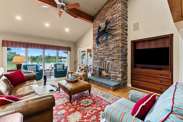 873 Deep Creek Rd, Lancaster, VA 22503 - living room with wood finished floors, high vaulted ceiling, ceiling fan, beam ceiling, and a stone fireplace