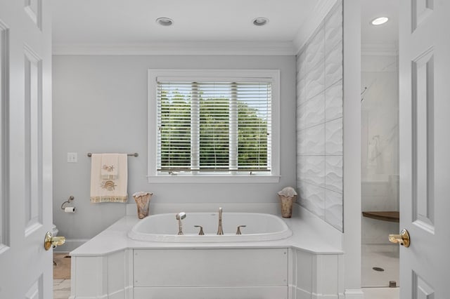 bathroom with ornamental molding and plus walk in shower