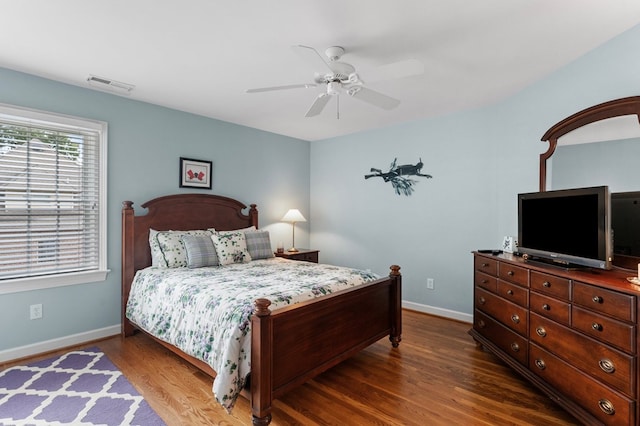 bedroom featuring ceiling fan and dark hardwood / wood-style floors