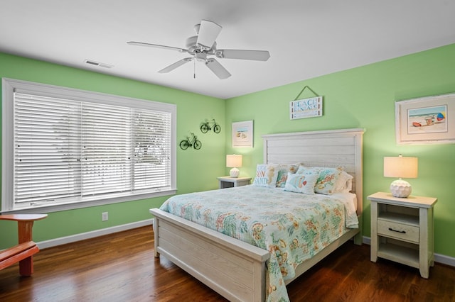 bedroom with ceiling fan and dark wood-type flooring