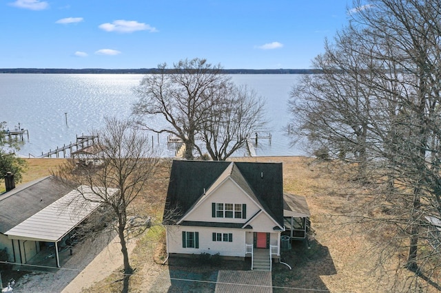 birds eye view of property featuring a water view