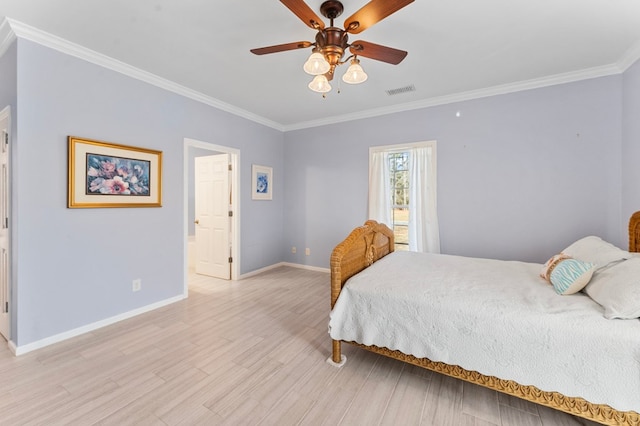 bedroom featuring light wood finished floors, visible vents, crown molding, baseboards, and a ceiling fan