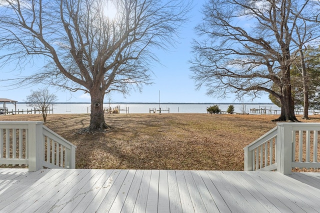 wooden deck with a water view