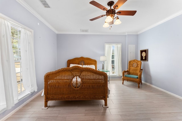 bedroom with visible vents, multiple windows, and baseboards