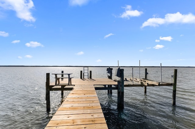 view of dock featuring boat lift and a water view