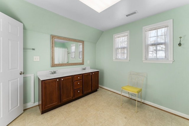 full bathroom with visible vents, a sink, baseboards, and double vanity