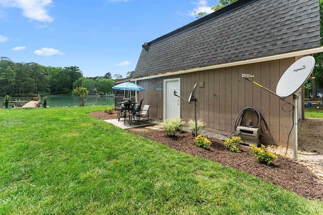 844 Monarch Shores Rd, Kilmarnock, VA 22482 - view of green lawn with a patio and a water view