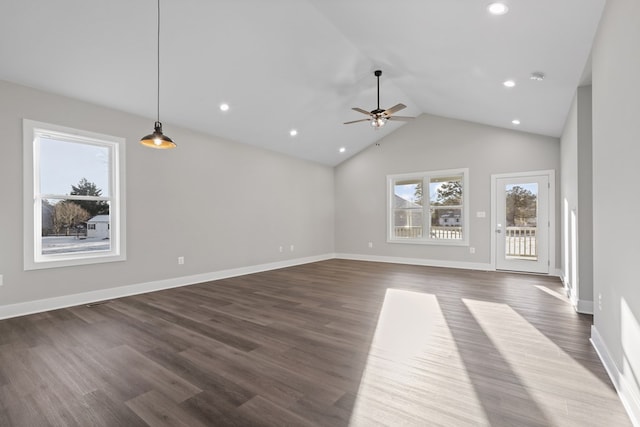 unfurnished living room with ceiling fan, dark hardwood / wood-style flooring, and high vaulted ceiling