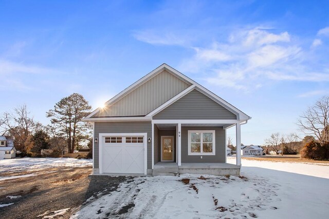 view of front of house with a porch and a garage