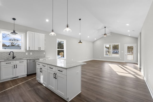 kitchen with ceiling fan, dishwasher, decorative backsplash, sink, and white cabinets