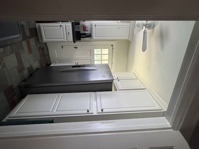 4503 Buckley Hall Rd, Cobbs Creek, VA 23035 - kitchen featuring white cabinets and tasteful backsplash