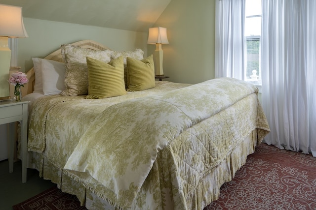 bedroom featuring vaulted ceiling