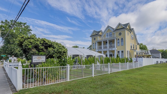 view of side of home featuring a lawn