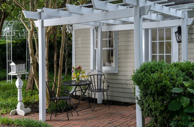 view of patio featuring a pergola