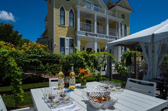 view of patio / terrace featuring a gazebo and a balcony