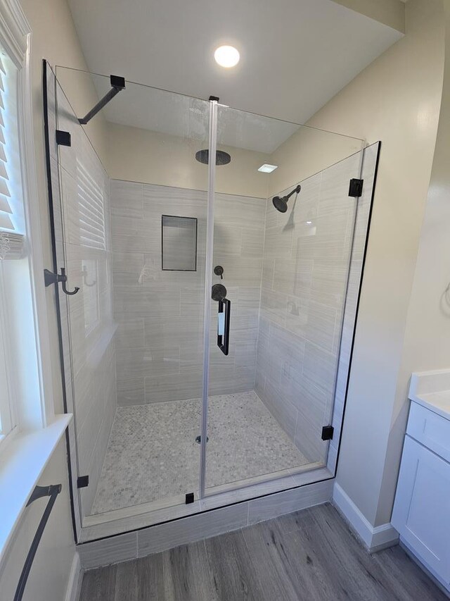 bathroom with tiled shower