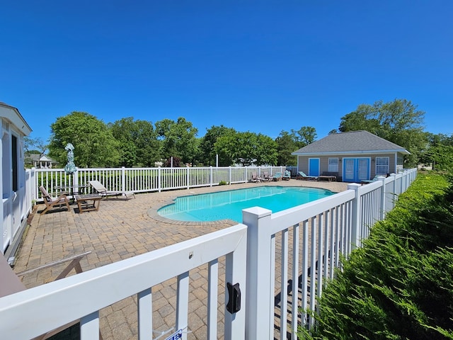 view of swimming pool featuring a patio