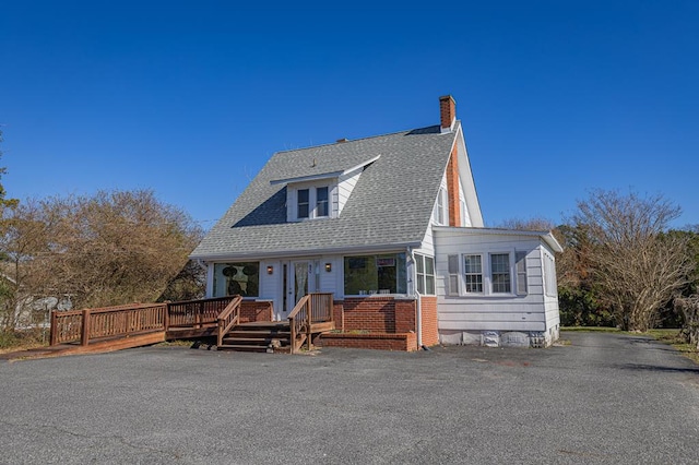 view of front of property with a wooden deck