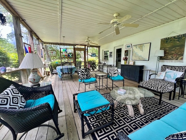 wooden deck featuring ceiling fan and an outdoor living space