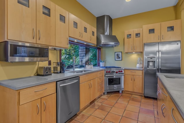 783 King Carter Dr, Irvington, VA 22480 - kitchen featuring light brown cabinets, wall chimney range hood, sink, light tile patterned floors, and appliances with stainless steel finishes