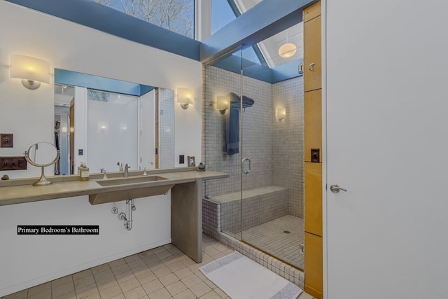 783 King Carter Dr, Irvington, VA 22480 - bathroom with tile patterned floors, sink, and a shower with shower door