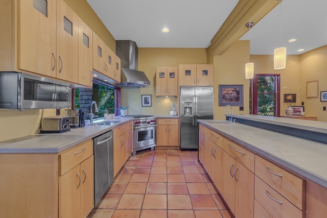 783 King Carter Dr, Irvington, VA 22480 - kitchen featuring wall chimney exhaust hood, stainless steel appliances, light brown cabinets, light tile patterned floors, and hanging light fixtures