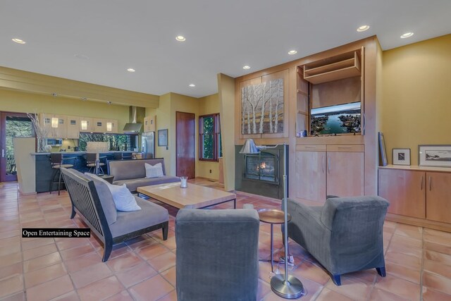 783 King Carter Dr, Irvington, VA 22480 - living room with a fireplace and light tile patterned floors