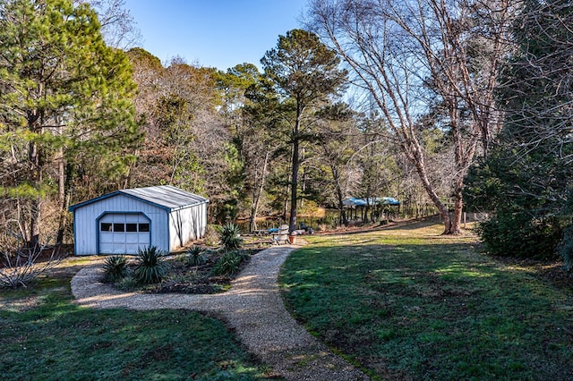 783 King Carter Dr, Irvington, VA 22480 - view of yard with a garage and an outbuilding