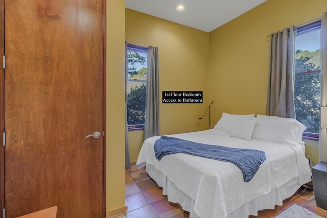 783 King Carter Dr, Irvington, VA 22480 - tiled bedroom with multiple windows