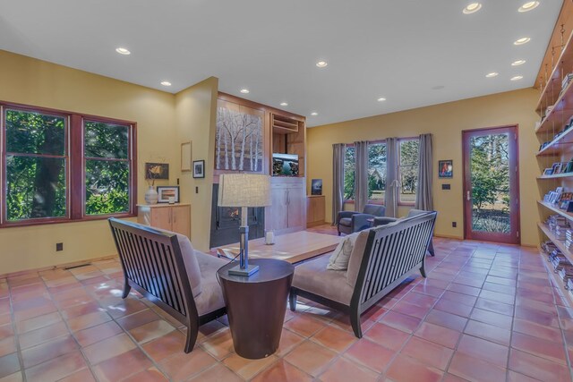 783 King Carter Dr, Irvington, VA 22480 - tiled living room with a fireplace