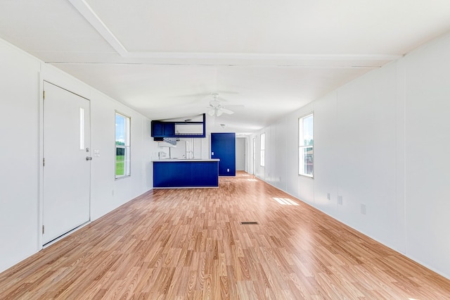 640 Ridge Rd, Callao, VA 22435 - unfurnished living room featuring light wood-style floors, ceiling fan, and vaulted ceiling