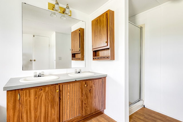 640 Ridge Rd, Callao, VA 22435 - full bathroom with wood finished floors, double vanity, and a shower stall