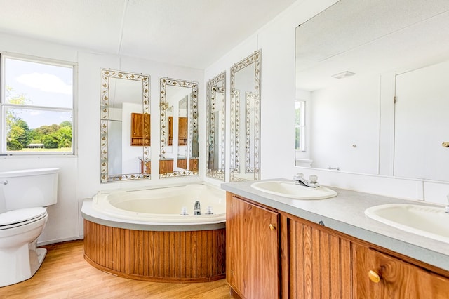 640 Ridge Rd, Callao, VA 22435 - bathroom with a bath, double vanity, and wood finished floors