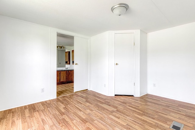 640 Ridge Rd, Callao, VA 22435 - unfurnished bedroom featuring light wood-type flooring and ensuite bathroom