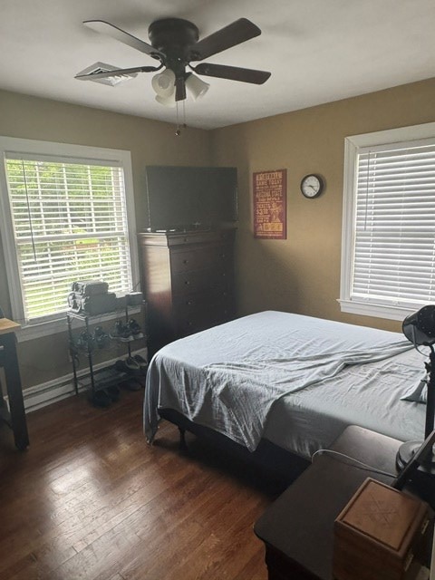 2266 Hayes Rd, Hayes, VA 23072 - bedroom featuring dark wood-style floors and a ceiling fan