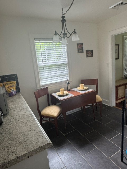 2266 Hayes Rd, Hayes, VA 23072 - dining room with dark tile patterned flooring
