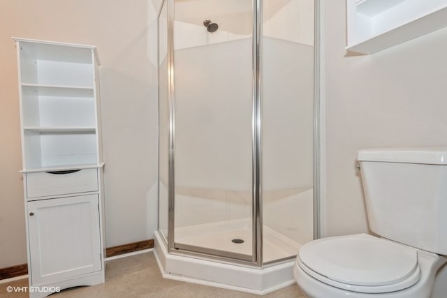 bathroom with toilet and an enclosed shower