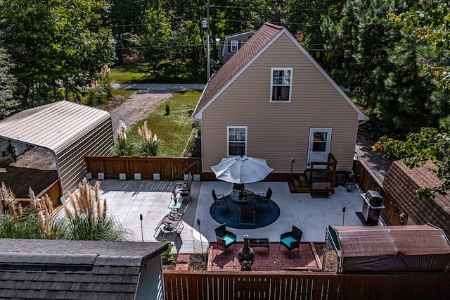 back of property featuring a patio area and an outdoor living space