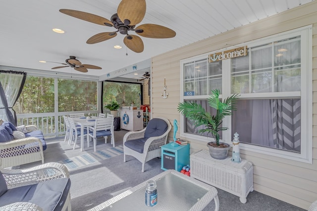 sunroom / solarium with ceiling fan