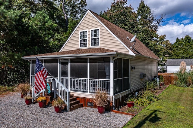 rear view of property with a yard