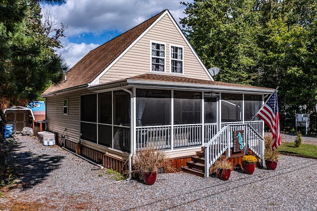 country-style home featuring a storage shed