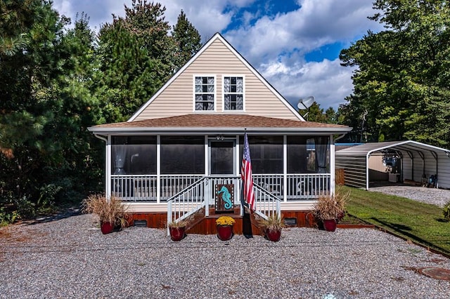 farmhouse with a sunroom and a carport