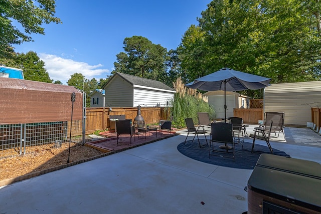 view of patio / terrace featuring a shed