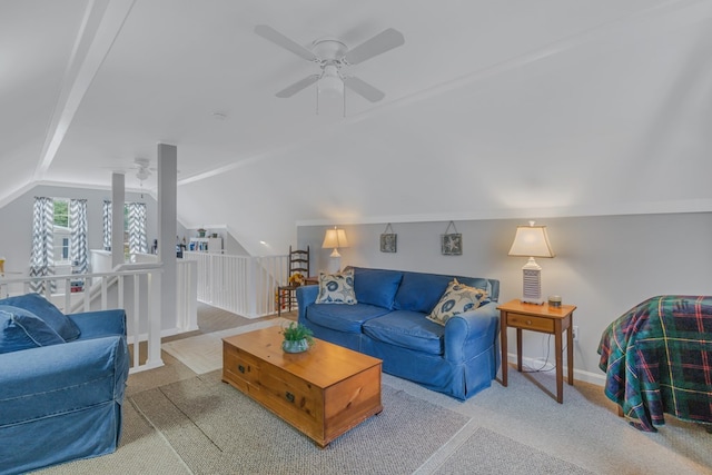 carpeted living room with ceiling fan and lofted ceiling